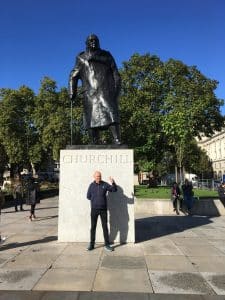 Donzo posing in front of the Churchill statue after receiving the Top UK Tour Guide Award