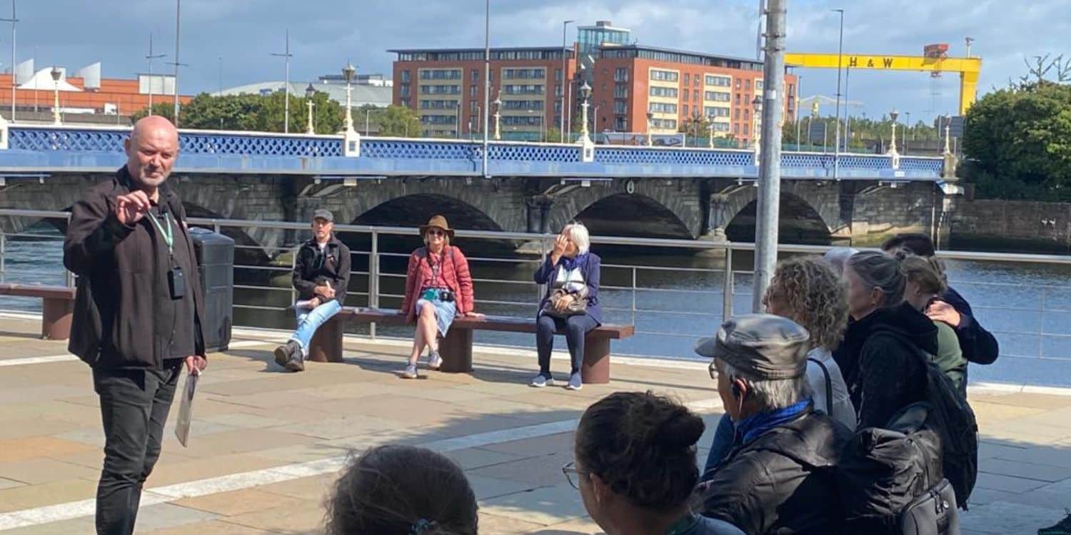 Donzo taking a tour group by the River Lagan.