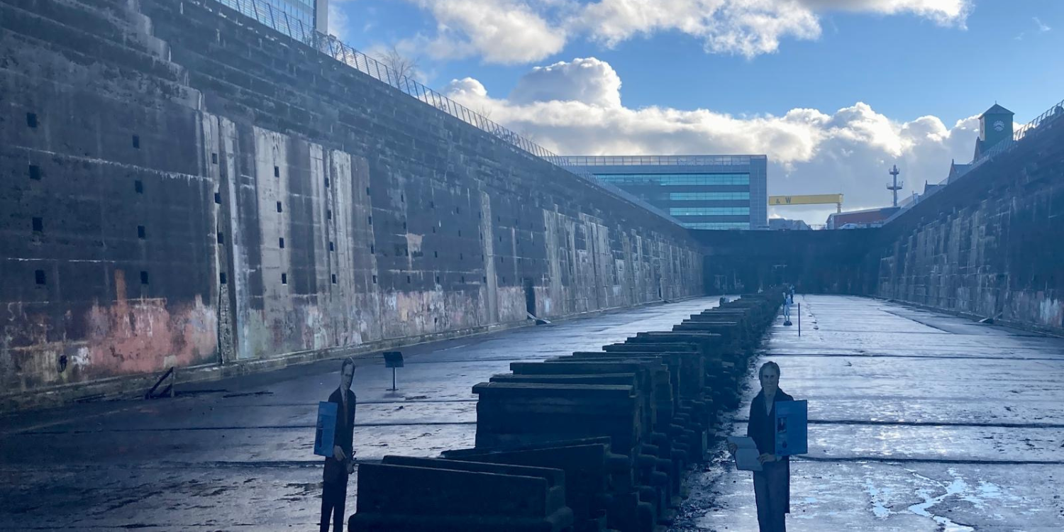 Cardboard cutouts of people give you an idea of the scale of the dock.